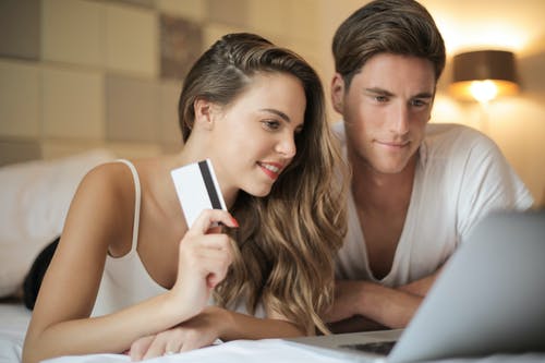 Couple shopping online via debit card