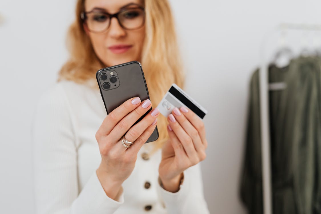 Woman buying women's clothes online in quarantine