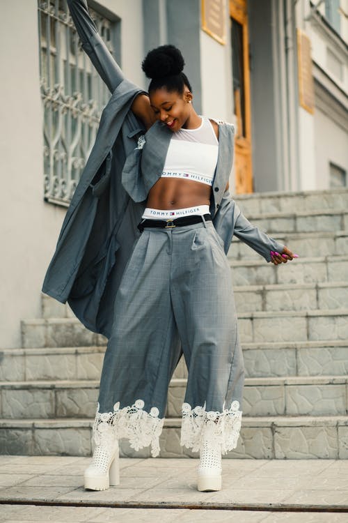 A woman wearing baggy grey pant