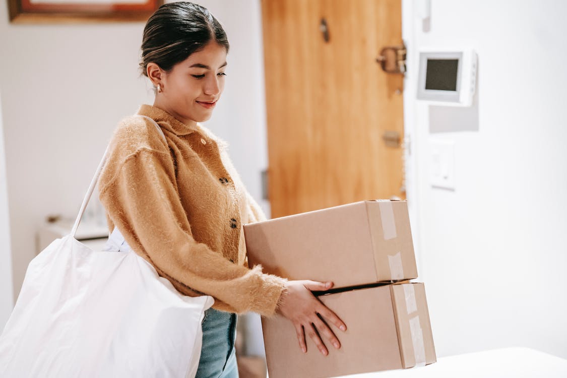 Woman receiving packages ordered online