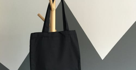 basic black tote bag on hanger